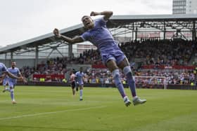 leeds have lift off: Raphinha goes airbourne after scoring from the penalty spot, left, to put Leeds United in the ascendency at Brentford. (Picture: Tony Johnson)