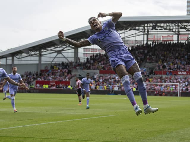 leeds have lift off: Raphinha goes airbourne after scoring from the penalty spot, left, to put Leeds United in the ascendency at Brentford. (Picture: Tony Johnson)