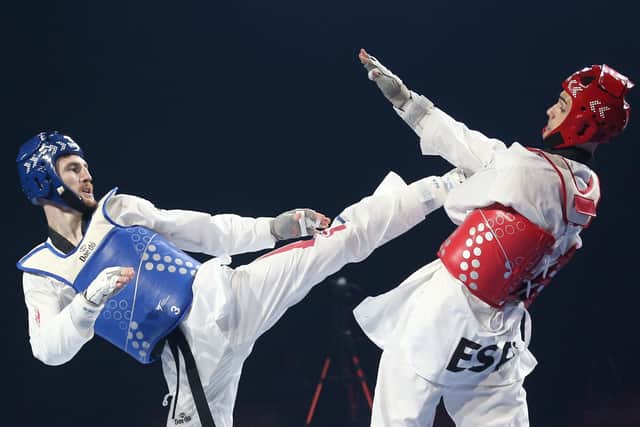 Great Britain's Bradly Sinden (Blue) and Spain's Javier Perez Polo (Red) during day three of the European Taekwondo Championships 2022 (Picture: PA)