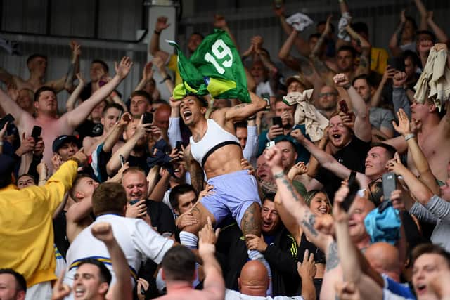 STAYING UP: Leeds United forward Raphinha celebrates with supporters. Picture: Getty Images.