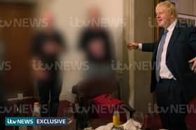 ITV handout photo dated 13/11/20 of a photograph obtained by ITV News of the Prime Minister raising a glass at a leaving party on 13th November 2020