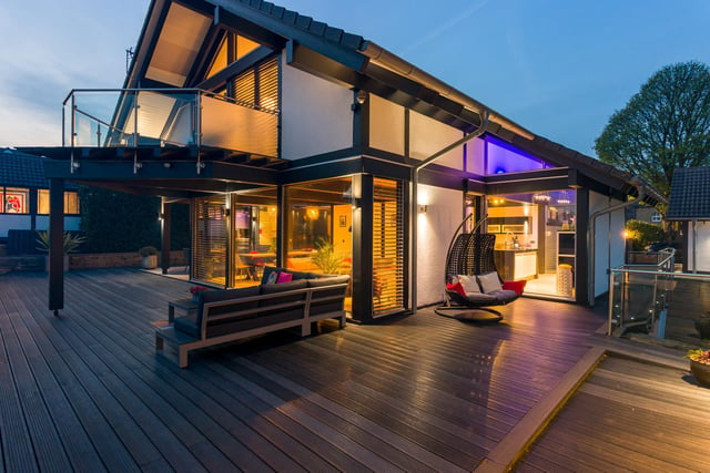 The property looks magical at night and is very energy efficient. It has a ground source heat pump that runs the underfloor heating and it also has solar thermal panels that heat the hot water.