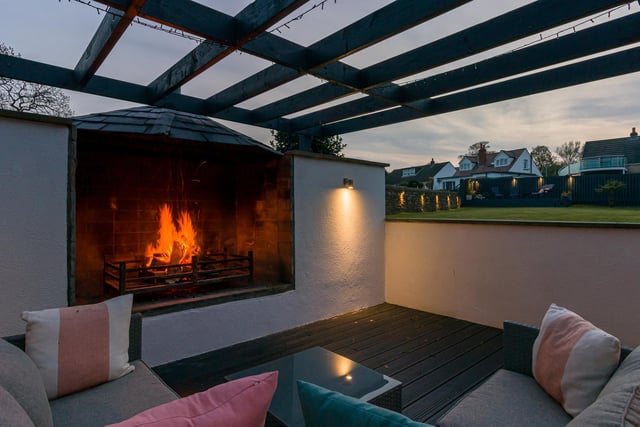 The house has an outside kitchen and fireplace, perfect for outdoor entertaining in the Yorkshire climate