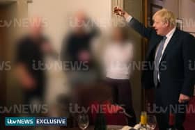 ITV handout photo dated 13/11/20 of a photograph obtained by ITV News of the Prime Minister raising a glass at a leaving party on 13th November 2020