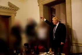 The Prime Minister raising a glass at one of the Downing Street gatherings.