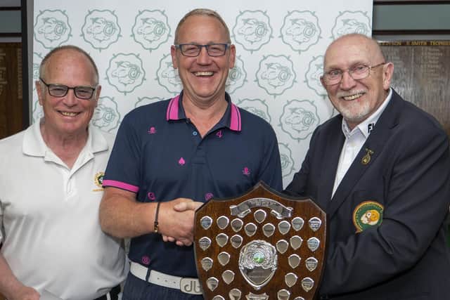 Halifax Bradley Hall's Jim Fairhurst receives the Halifax-Huddersfield Union's seniors stroke play Championship Shield from Phil Tatlock, right, sponsor of the event in honour of his late wife Elizabeth A Tatlock. Left is the union's president Glynn Mellor (Elland).