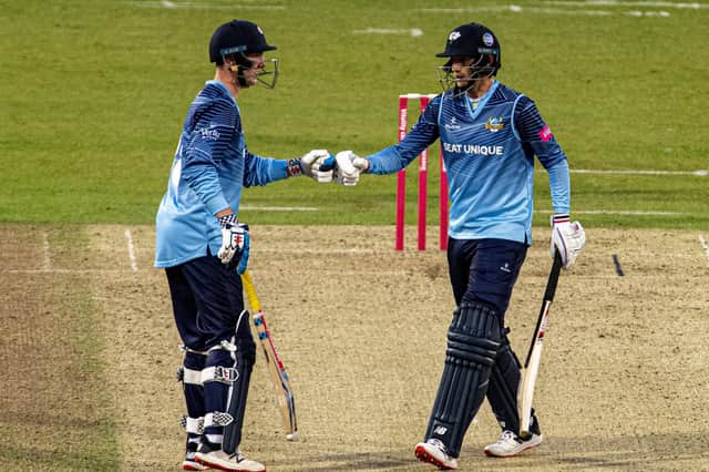Vikings' Harry Brook and  Joe Root tap as their partnership takes them to victory. Picture: Tony Johnson
