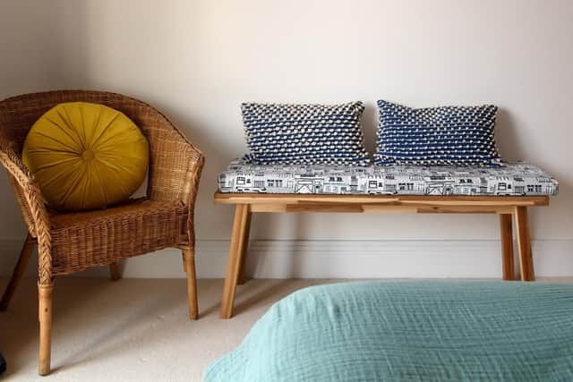 A one off batch of Coastal design fabric covers the seating cushion on this Ikea bench