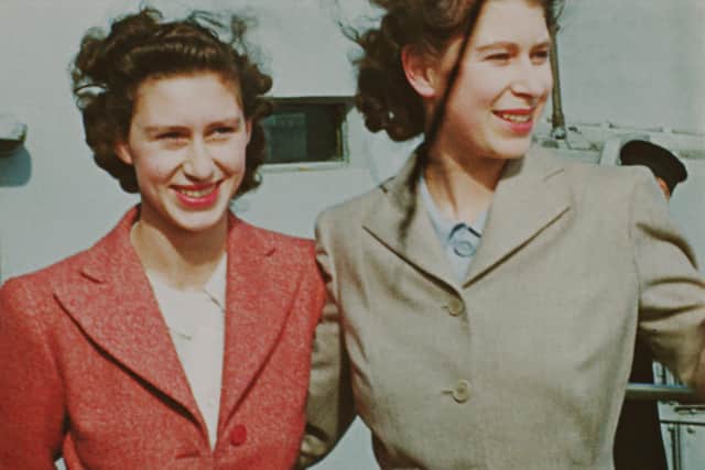 A image, from BBC documentary 'Elizabeth: The Unseen Queen', of Princess Margaret and Princess Elizabeth with their father King George VI onboard HMS Vanguard in 1947