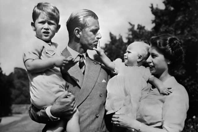Undated picture showing the Royal British couple, Britain's Queen Elizabeth II, and her husband Britain's Prince Philip, Duke of Edinburgh, with their two children, Charles, Prince of Wales (L) and Princess Anne (R). (Photo by - / AFP) (Photo by -/AFP via Getty Images)
