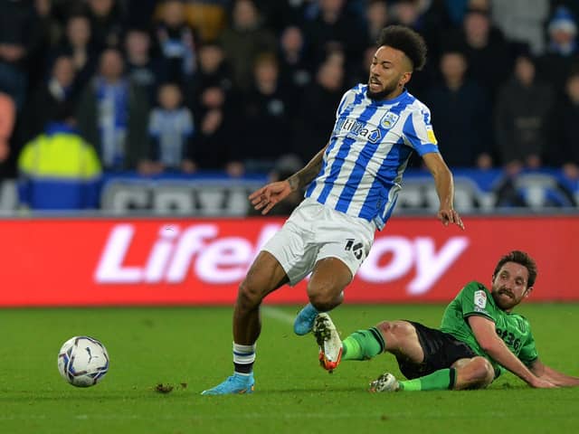 ON THE RISE: Huddersfield Town's Sorba Thomas battles with Stoke City's Joe Allen in January this year Picture: Bruce Rollinson