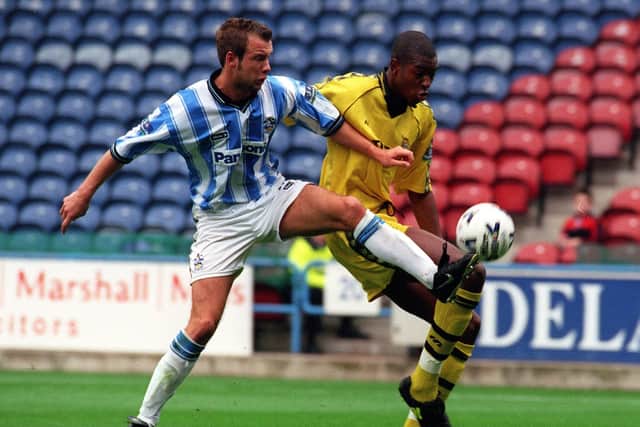 TERRIERS' HERO: Huddersfield Town's Marcus Stewart tussles with Port Vale's Anthony Gardner.