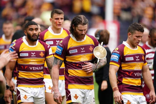 Huddersfield Giants' Chris McQueen (centre) reacts to defeat at the Tottenham Hotspur Stadium Picture: Mike Egerton/PA