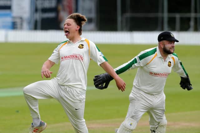 Pudsey St Lawrence's Charlie Parker celebrates taking a second wicket in his first over by getting New Farnley's Lee Goddard caught for 0 by Chris Marsden. Picture: Steve Riding.