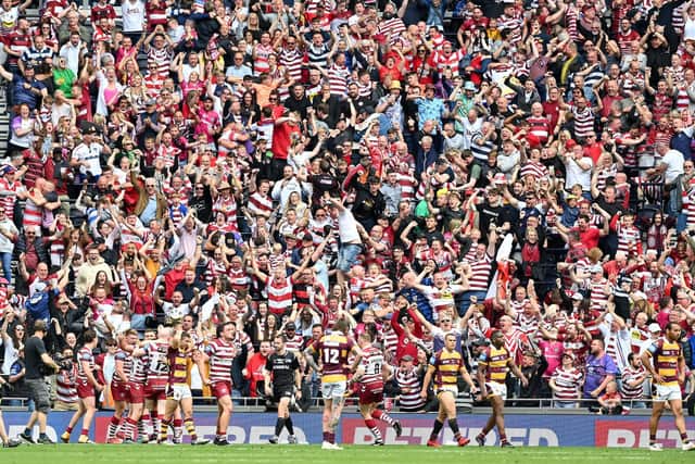 CRUCIAL BLOW: Wigan Warriors' fans celebrate their team's late, match-winning try in the Challenge Cup Final again st Huddersfield Giants at Tottenham Hotspur Stadium Picture by Will Palmer/SWpix.com
