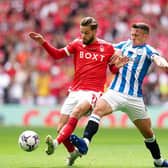 Huddersfield Town captain Jonathan Hogg tussles with Nottingham Forest rival Philip Zinckernagel. Picture: PA