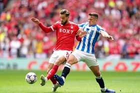 Huddersfield Town captain Jonathan Hogg tussles with Nottingham Forest rival Philip Zinckernagel. Picture: PA
