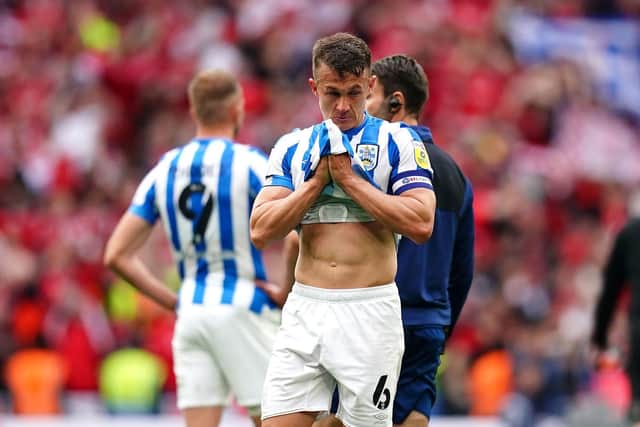Pain is etched all over the face of Huddersfield Town captain Jonathan Hogg. Picture: PA