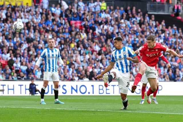 UNLUCKY: Huddersfield Town's Levi Colwill (centre) scores an own goal to put Nottingham Forest ahead in Championship play-off final at Wembley Picture: John Walton/PA