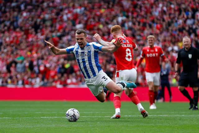 APPEAL REJECTED: Huddersfield Town's Harry Toffolo goes tumbling under a challenge from Nottingham Forest's Jack Colback  at Wembley Picture: William Early/Getty Images)
