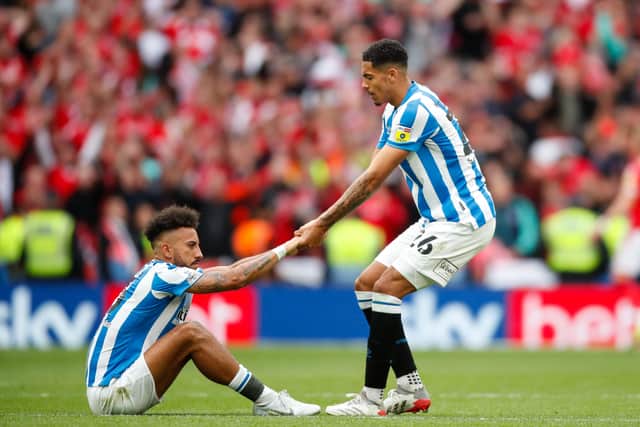 PICK ME UP: Levi Colwill consoles Huddersfield Town team-mate Sorba Thomas after losing the Championship Play-Off Final against Nottingham Forest at Wembley Picture: John Early/Getty Images