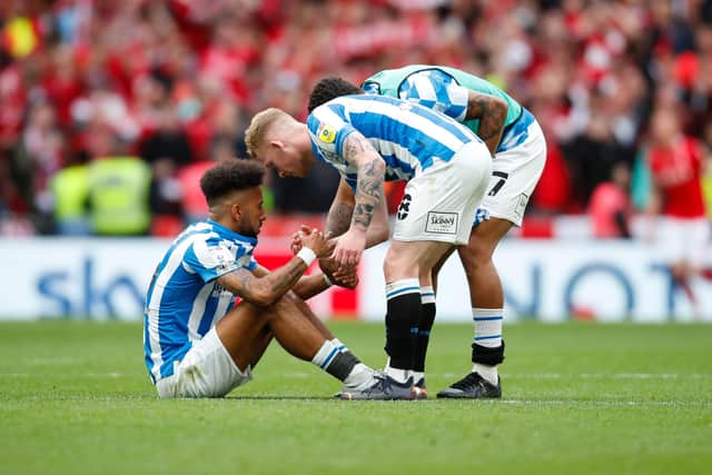 Huddersfield Town's Lewis O'Brien and Tino Anjorin console team-mate Sorba Thomas after losing to Nottingham Forest at Wembley Picture: John Early/Getty Images