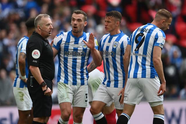 Huddersfield Town's Harry Toffolo remonstrates with referee Jon Moss after being booked for diving during the Championship Play-Off Final against Nottingham Forest at Wembley Picture: Mike Hewitt/Getty Images
