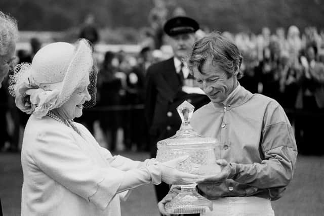 Royal appointment: Lester Piggott receiving the Ritz Club trophy from the Queen Mother in 1981. Picture: PA