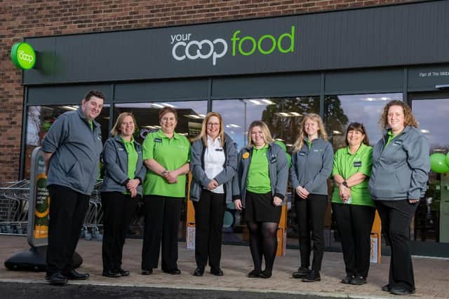 Team members from The Midcounties Co-operative wearing the branded uniforms produced and supplied by Infinity Inc.