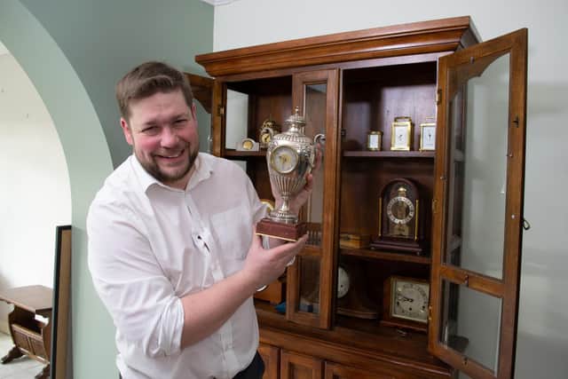 Angus with Kenneth's collection of clocks