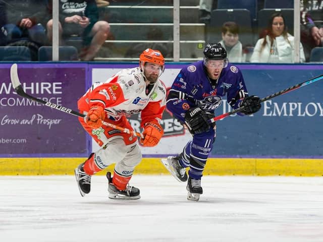 END OF AN ERA: Matt Haywood (right) battles with Sheffield Steelers' Evan Mosey while playing for Glasgow Clan last season Picture courtesy of EIHL/Al Goold