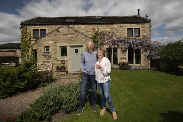 John and Becca Farrar at Heron Barn, the home they bought five years ago, near Sowerby Bridge. John has done all the landscaping himself. Pictures by Simon Hulme.
