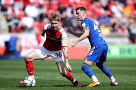 STICKING AROUND: Rotherham United's Jamie Lindsay (left). Picture: Isaac Parkin/PA