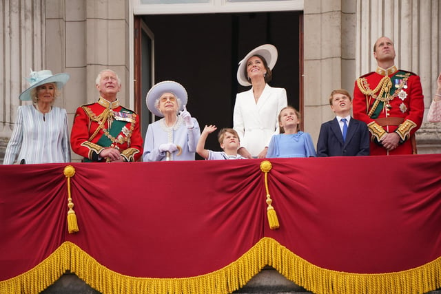 The Duchess of Cornwall, the Prince of Wales , Queen Elizabeth II , Prince Louis, the Duchess of Cambridge, Princess Charlotte, Prince George, and the Duke of Cambridge, on the balcony of Buckingham Palace, to view the Platinum Jubilee flypast