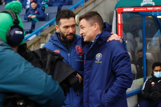 DECISIONS TO MAKE: For Huddersfield boss Carlos Corberan, left, and Sheffield United manager Paul Heckingbottom, right. Picture: Getty Images.