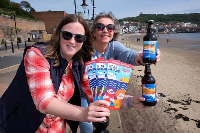 Books by the Beach organiser Heather French with Kate Balchin, representing festival supporter Wold Top Brewery.