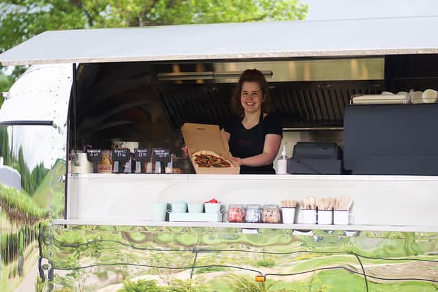 Chef, Lizzie Myers with one of her pizza creations. Photo: Jessica Kett