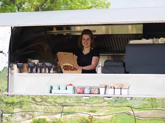 Chef, Lizzie Myers with one of her pizza creations. Photo: Jessica Kett