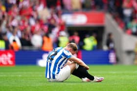 PAIN AND DESPAIR: Huddersfield Town's Tom Lees looks dejected after defeat to Nottingham Forest in the Sky Bet Championship play-off final at Wembley Stadium last Sunday Picture: John Walton/PA