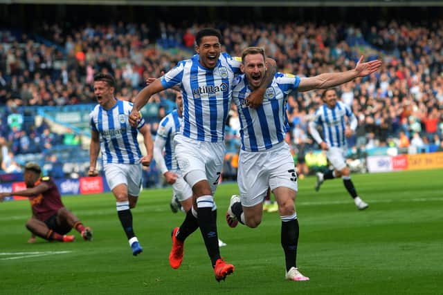 STAYING POSITIVE: Huddersfield Town's Tom Lees celebrates with Levi Colwill after opening the scoring against Hull City last season Picture : Jonathan Gawthorpe