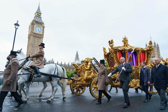 The gold state coach passes the Houses of Parliament during an early morning rehearsal through London ahead of the Platinum Jubilee Pageant, which will mark the finale of the Platinum Jubilee Weekend. Picture: Dominic Lipinski/PA.