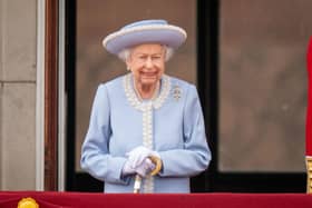 Queen Elizabeth II watching the Royal Procession from the balcony at Buckingham Palace following the Trooping the Colour ceremony in central London
