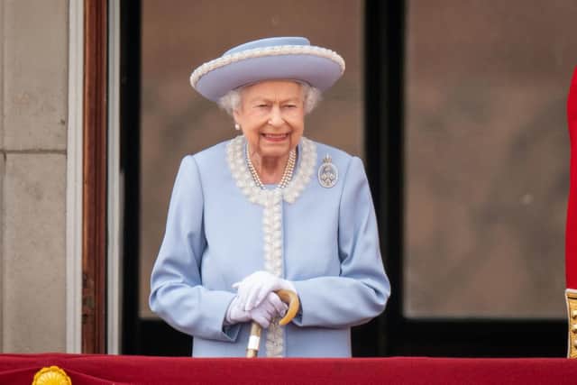 Queen Elizabeth II watching the Royal Procession from the balcony at Buckingham Palace following the Trooping the Colour ceremony in central London