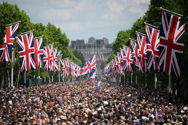 Members of the public fill the Mall before a flypast during the Trooping the Colour ceremony at Horse Guards Parade, central London