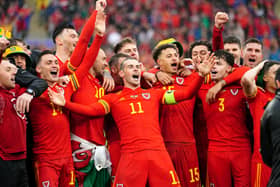 Wales' Gareth Bale (centre) celebrates with team-mates and staff after qualifying for the Qatar World Cup following victory in the FIFA World Cup 2022 Qualifier play-off final match at Cardiff City Stadium over Ukraine. Picture: David Davies/PA Wire.