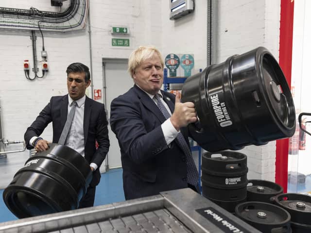 Prime Minister Boris Johnson (right) with Chancellor of the Exchequer Rishi Sunak during a visit to Fourpure Brewery in Bermondsey, London last October.