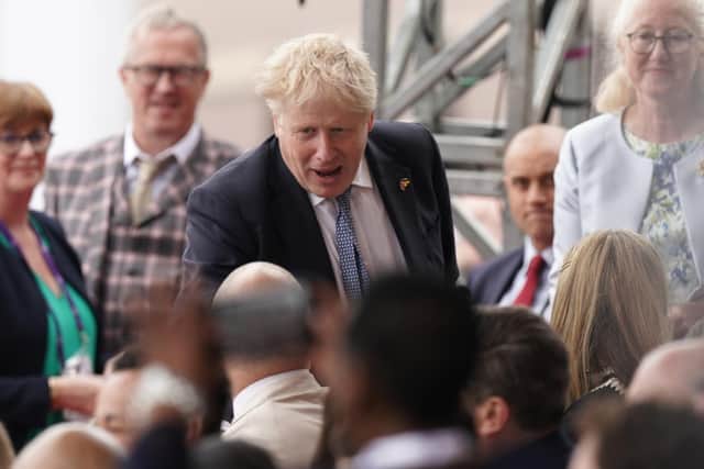 Prime Minister Boris Johnson arrives to watch the Platinum Jubilee Pageant in front of Buckingham Palace, London, on day four of the Platinum Jubilee celebrations. Picture date: Sunday June 5, 2022.