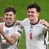 England's Harry Maguire and John Stones celebrate victory after the UEFA Euro 2020 Championship Semi-final match against Denmark. (Picture: Michael Regan - UEFA/UEFA via Getty Images)