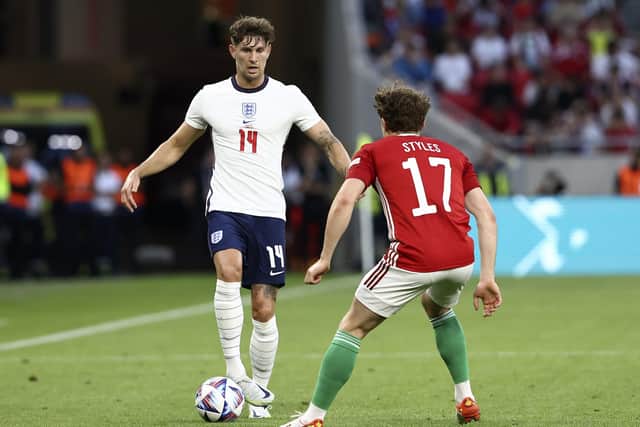 England's John Stones (left) and Hungary's Callum Styles battle for the ball during the UEFA Nations League match at the Puskas Arena, Budapest. Picture: Trenka Attila/PA