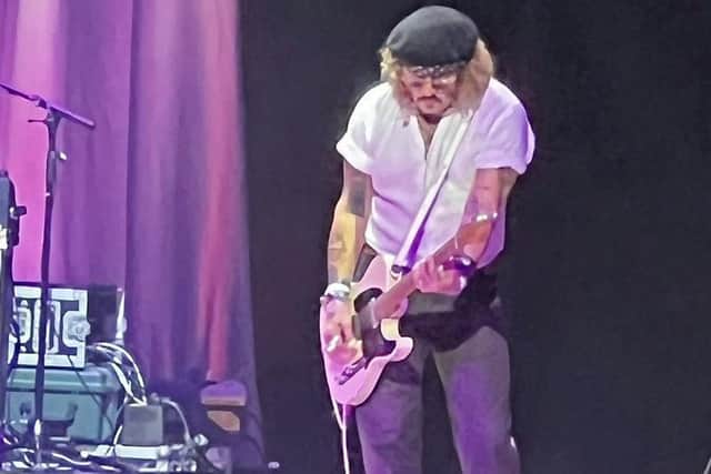 Johnny Depp played on the guitar as well as singing for shocked fans at Sheffield City Hall in May